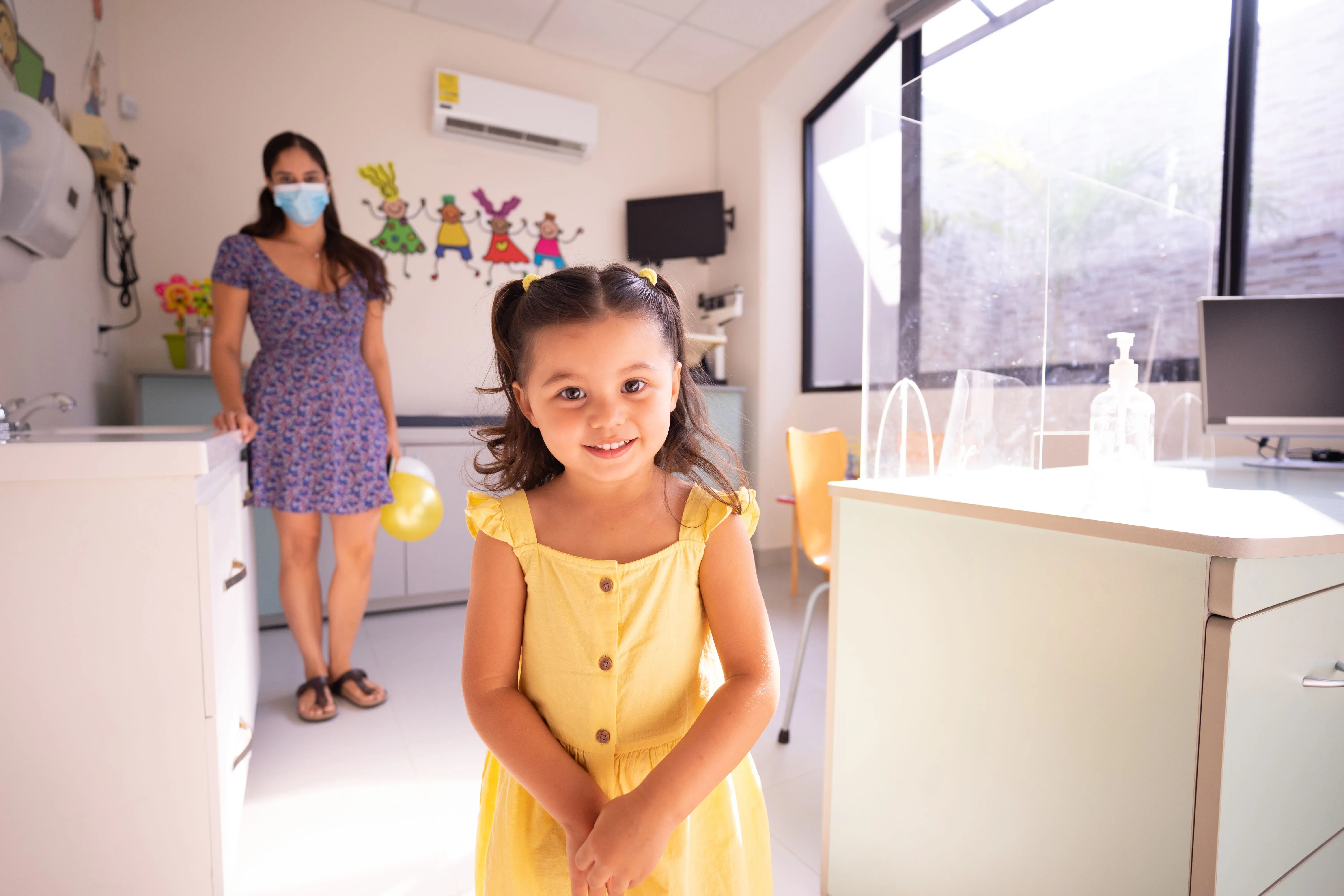 A smiling young patient at Main Street Medical on Hilton Head Island
